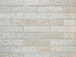 Brick grey and beige wall,  decorative texture on the bricks. It can be used as decorative facade for house or other outdoor constructions. Brick background. Grey wall close up. 