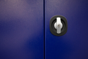 Close up keys lock in blue metal door