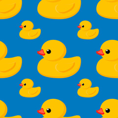 Seamless cute pattern. Yellow rubber duck on a blue background. Fashion textiles and decorative fabrics. 