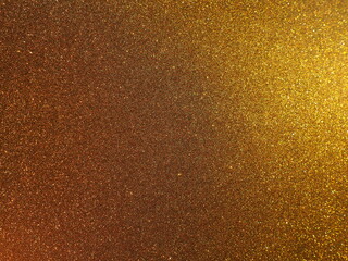 Bokeh light of gold glitters. Golden glitter texture background. Sparkling glitter wrapping paper...