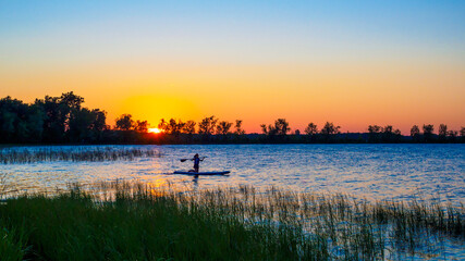 Naklejka premium sunset over lake