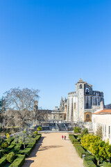 Fototapeta premium Convent of Christ or 'Convento de Cristo' is ornately sculpted, Manueline style, hilltop Roman Catholic convent in Tomar, Portugal. Templar stronghold complex is a historic and cultural monument.