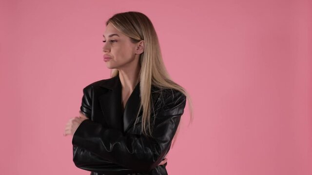 Blonde woman in a jacket is outraged