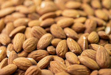 Macro shooting of dry Almond Nuts.Vegetarian food rich in minerals and vitamins. Selective focus