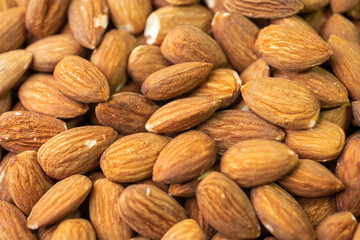 Macro shooting of dry Almond Nuts.Vegetarian food rich in minerals and vitamins. Selective focus