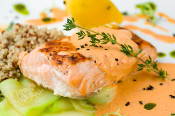 Salmon steak on the grill on white plate macro close up