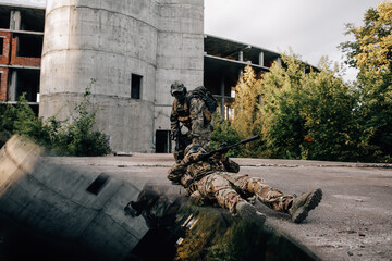 Soldier dragging a wounded partner