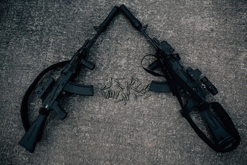 Two rifles with bullets lie on the ground leaning against their trunks, the terrorists surrendered...