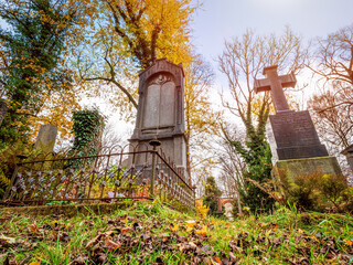 Tombstone cemetery tomb stone with autumn color background