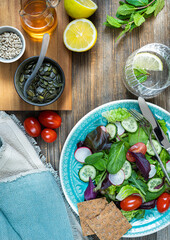 Bowl of salat,pumkin and sunflower seeds,olive oil,fork and knife.Tasty and healthy food concept. Flat lay. Rustic food photography..