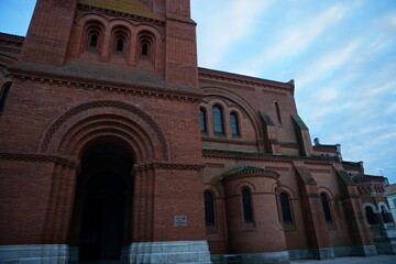 Fototapeta na wymiar red brick facade church in france