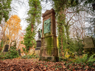 Tombstone cemetery tomb stone with autumn color background