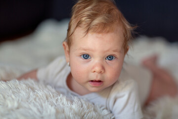 Adorable baby with beautiful blue eyes.crawling baby.child smiling.