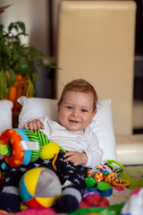 Obraz premium Smiling little girl is playing with baby toy.Little toddler