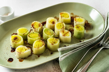 French leek with vinaigrette and balsamic sauce on the table