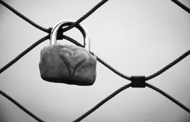 Love lock with heart attached to bridge in Paris, France. Valentine's day background. Lost love....