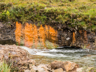 Metals ores released from the soil at Broadford Bay, Isle of Skye, Scotland, Uk