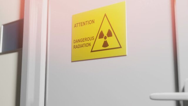Door with inscription Attention Dangerous Radiation.