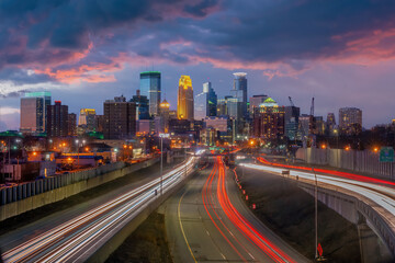 Beautiful Minneapolis downtown city skyline with traffic light at sunset