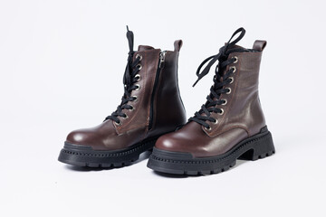 Graceful women's leather demi-season ankle boots with low heels. Studio photo for the catalog of the new collection of women's shoes 2022