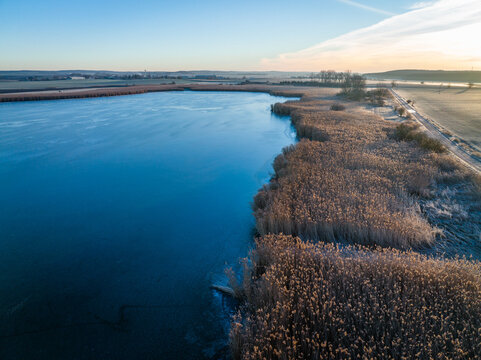Frozen fishpond from drone aerial view