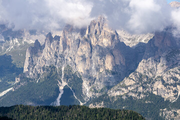Dolomite peaks in the clouds. View from the Lino-Pederiva trail.