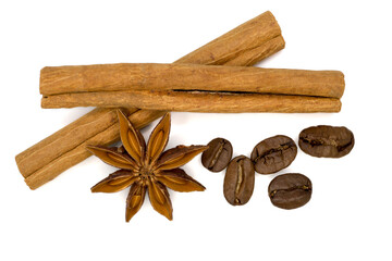 cinnamon, anise and coffee grains isolated on white background