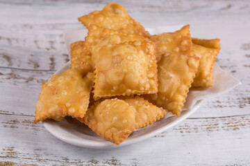 Traditional pastry called pastel  in Brazil. Brazilian snack. Brazilian pastry