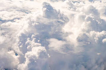 View over the clouds above Tanzania. Bright skyscape