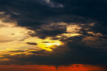 Fototapeta na wymiar Burning sky in the evening . Dark and orange dramatic sky