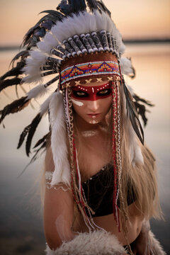 girl dressed as an Indian at sunset