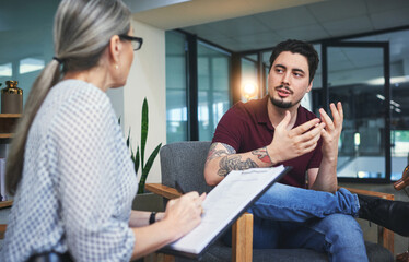 Give your feelings a voice. Shot of a young man having a therapeutic session with a psychologist.