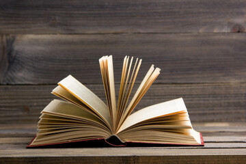 Old books on a wooden shelf. Back to school