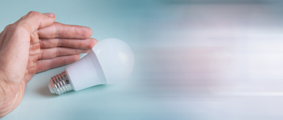 hand holding a light bulb