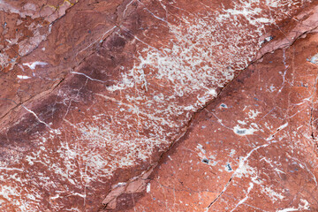 Fototapeta premium Natural red marble pattern with white veins, photo texture