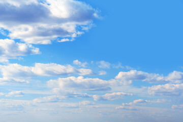 Naklejka na ściany i meble Cloudy sky background on a clear sunny morning, copy space