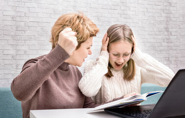 Mother yelling at daughter while doing homework