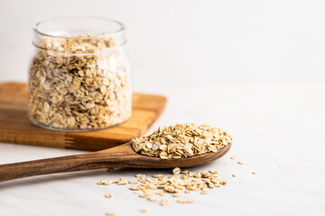 Breakfast cereals. Uncooked oatmeal. Raw oat flakes.