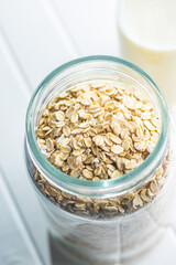 Uncooked oatmeal. Raw oat flakes.