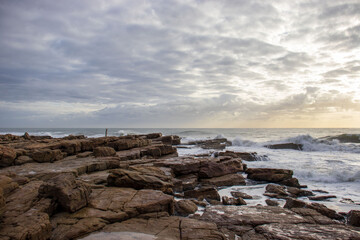 View of the ocean with rocks and morning clouds in South Africa