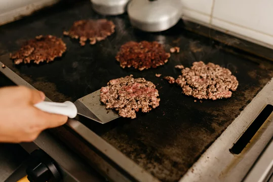 Snack - producing hamburger for the smash burger snack Photos | Adobe Stock
