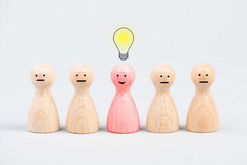 Group of people standing together, one has an idea, light bulb over a person, leadership concept,...
