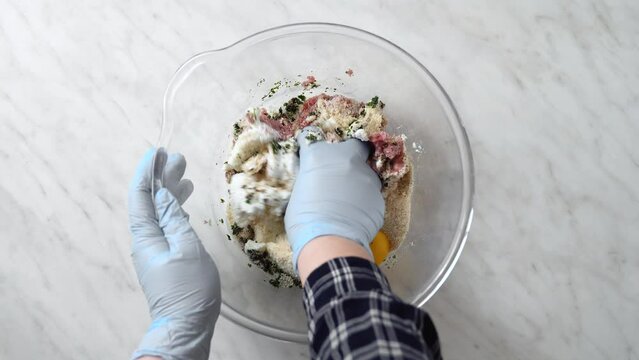 cook meatloaf by mixing minced meat with cheese and other ingredients