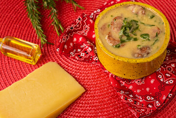 Soup - Green broth with sausage and cabbage, with grated cheese