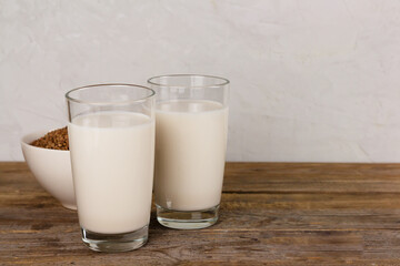 Two glasses with alternative dairy free buckweat milk. Lactose free beverage