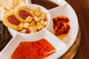 Cold cuts board with cheese, antipasto, salami and pepper jelly