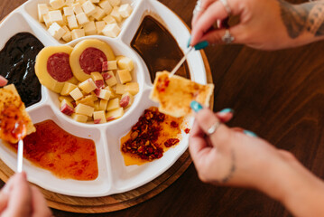 Cold cuts board with cheese, antipasto, salami and pepper jelly