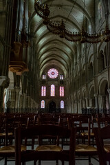 Fototapeta na wymiar Interieurs of old gothic Roman Catholic church in central part of old French city Reims, France