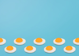 Omelet. Design template in minimal style with copy space. Many small fried egg on blue backdrop
