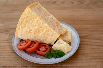 Cheese collection, piece of matured cow cheese pasmesan parmigiano reggiano made from cow milk